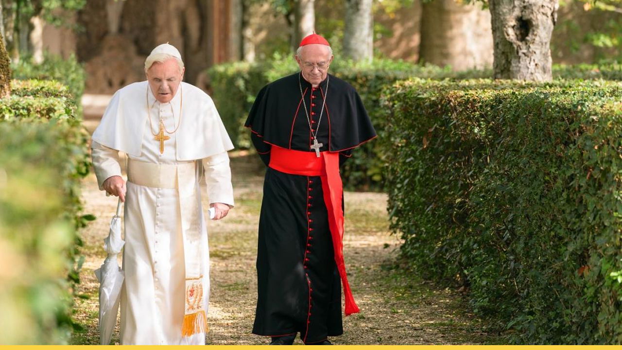 The two men, now both retired from their papal roles, walk through the peaceful, serene garden at the Vatican, where their conversation shifts from lighthearted to profound