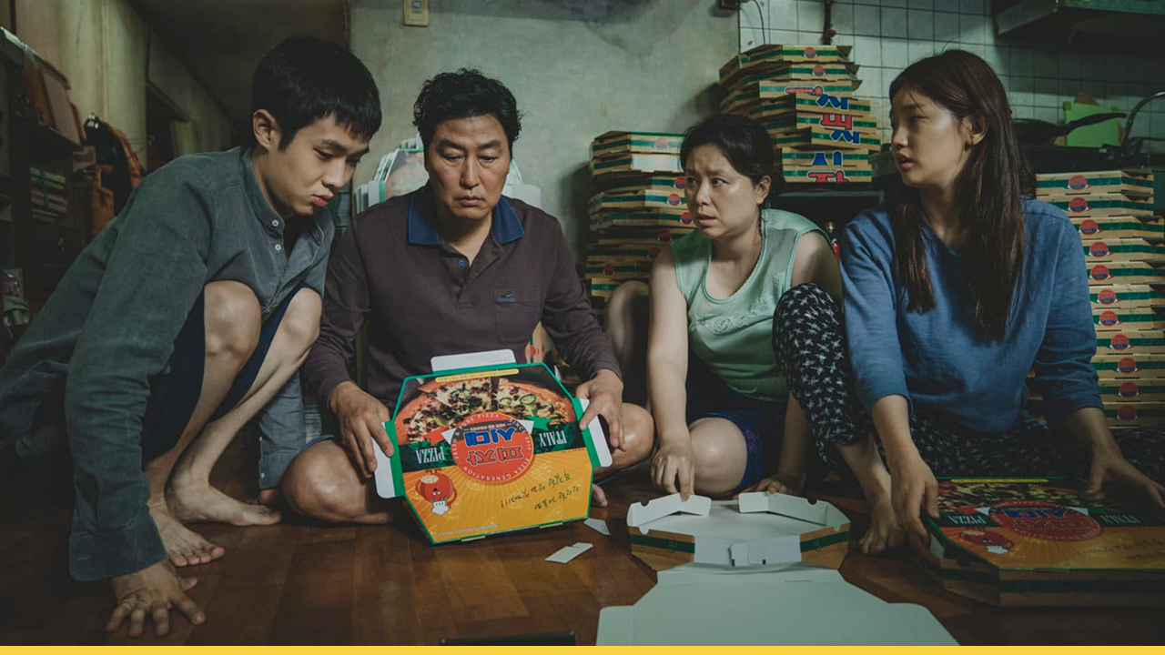 The family from Parasite folding pizza boxes in their small apartment