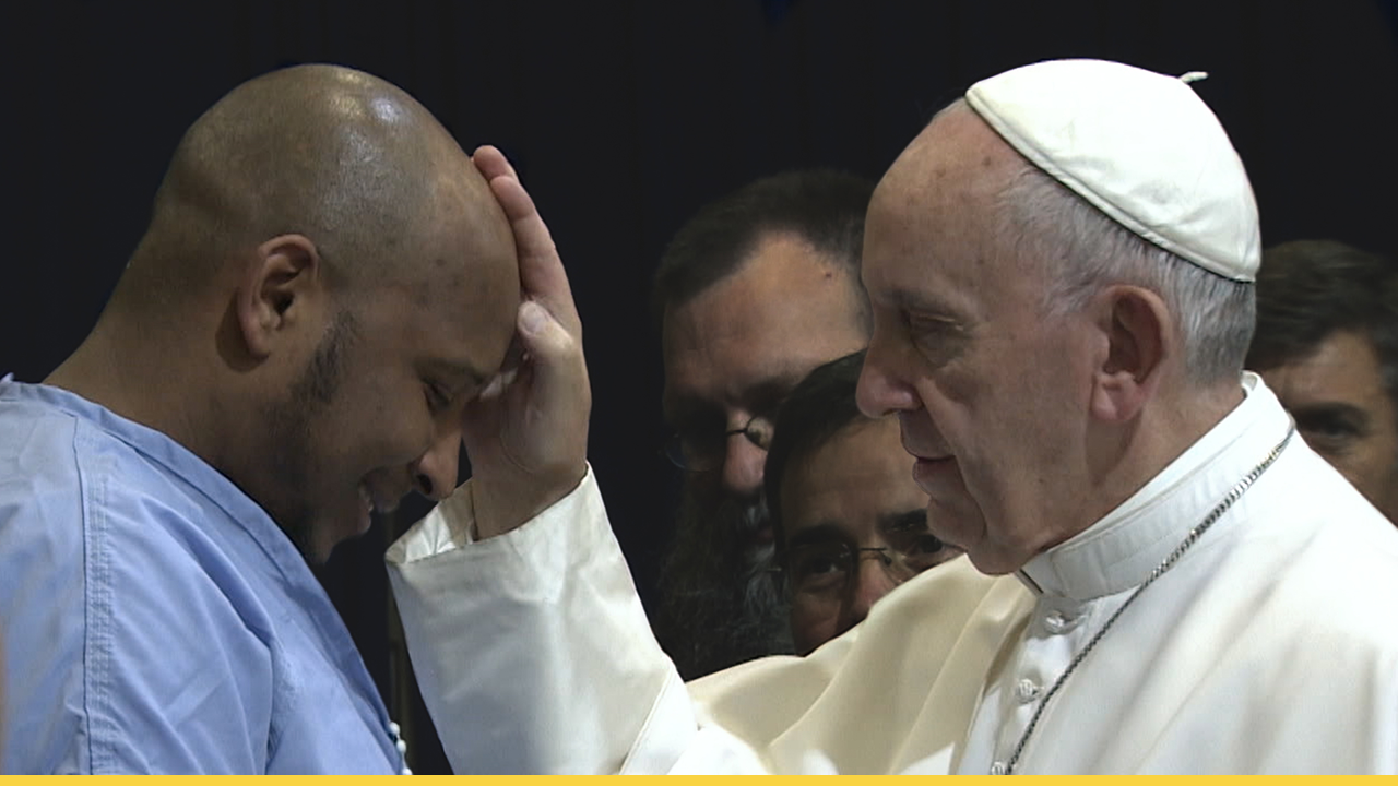 Pope Francis (played by Javier Bardem) blesses a man, demonstrating his deep humility and compassion