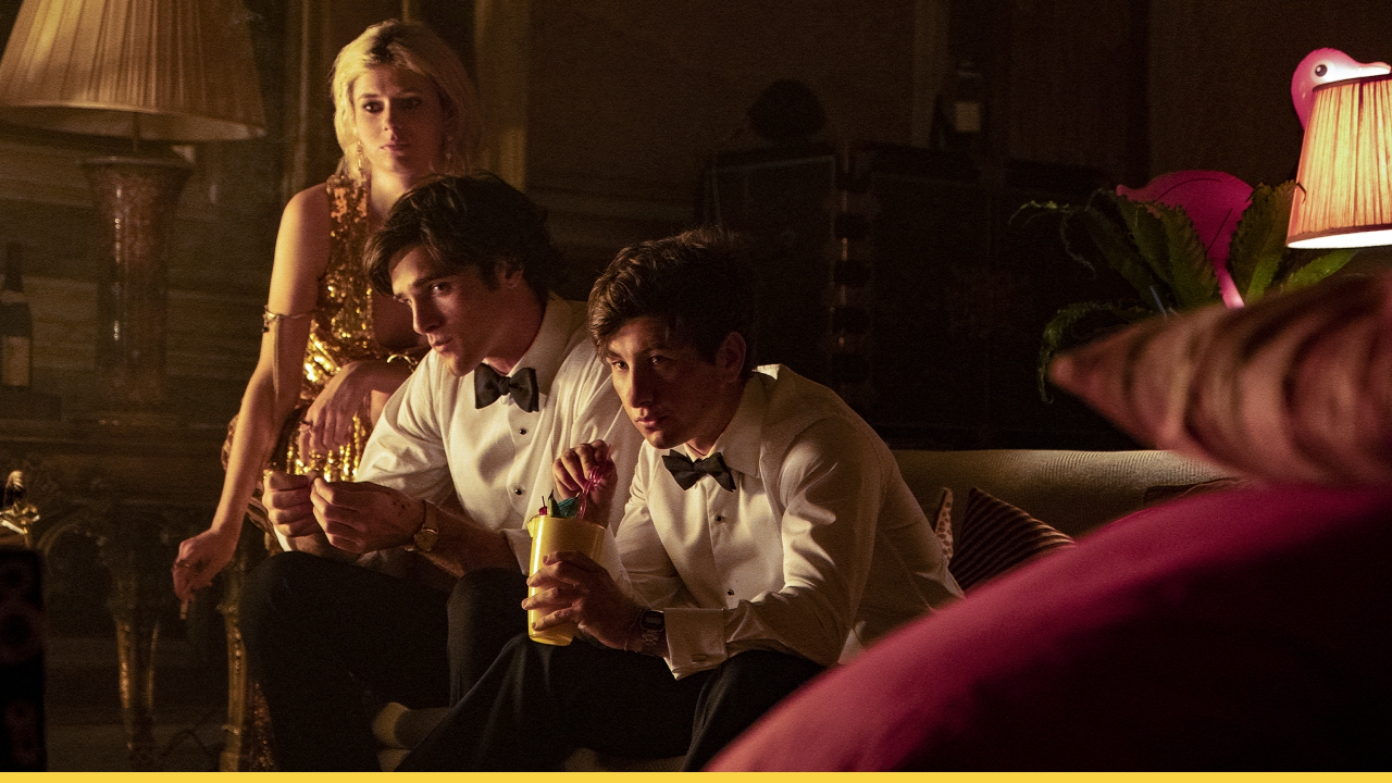 Three characters from Saltburn sitting in a dimly lit room after a party
