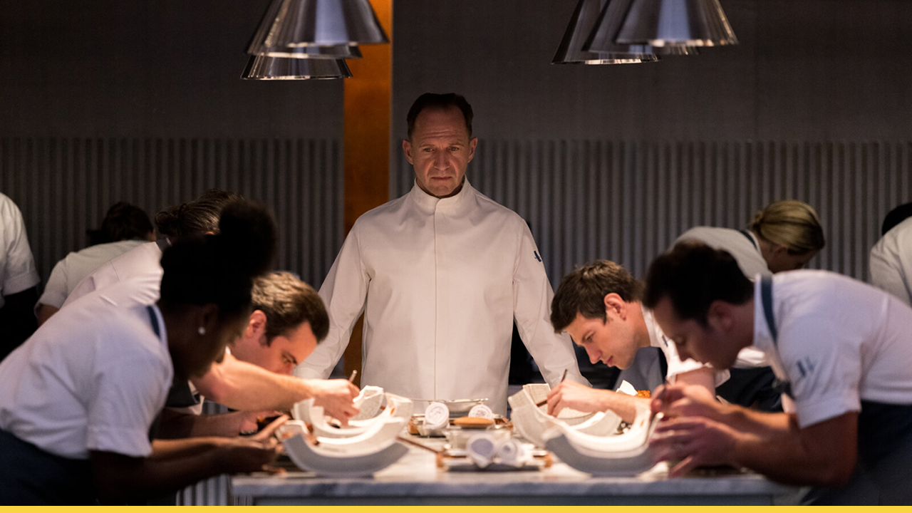 A perfectionist chef oversees his team with quiet intensity as they craft meticulous culinary art