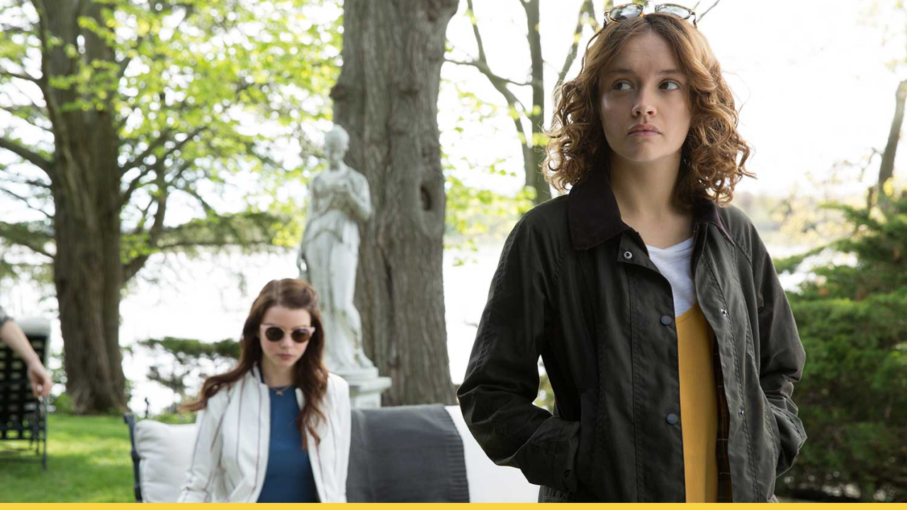 Two characters from Thoroughbreds standing in a garden, one looking away